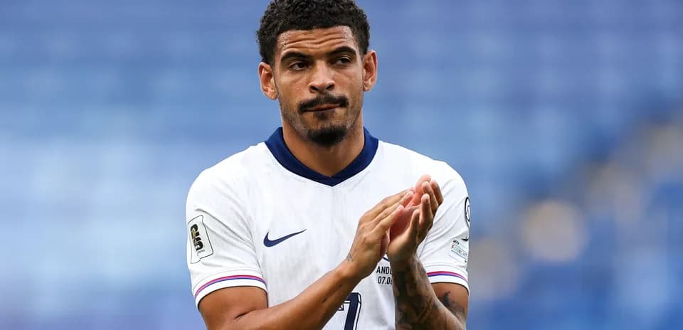 Player applauding on the field after match