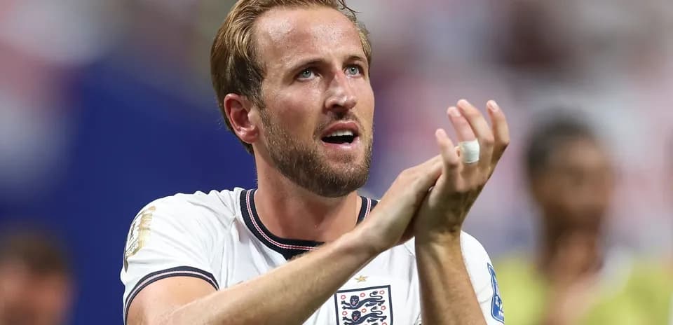 Player clapping during match celebration wearing England jersey