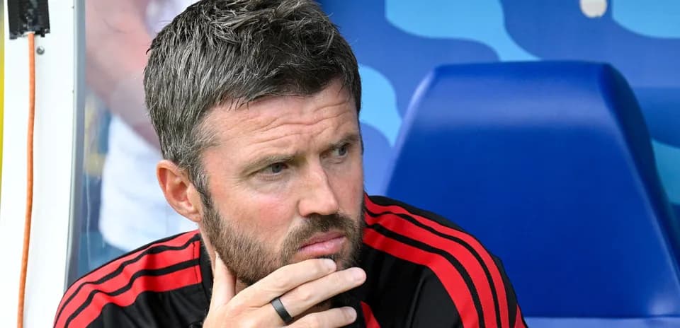 Coach sitting on bench during match