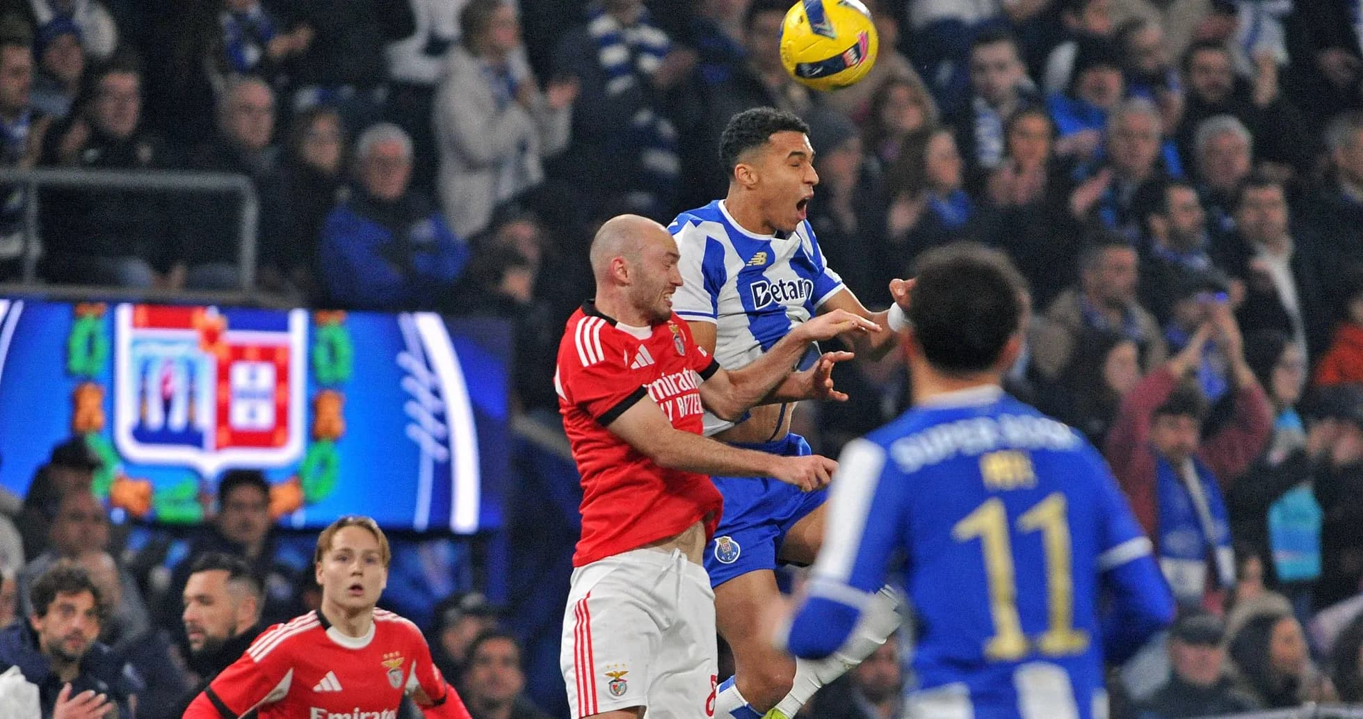 Players contesting a high ball during match action