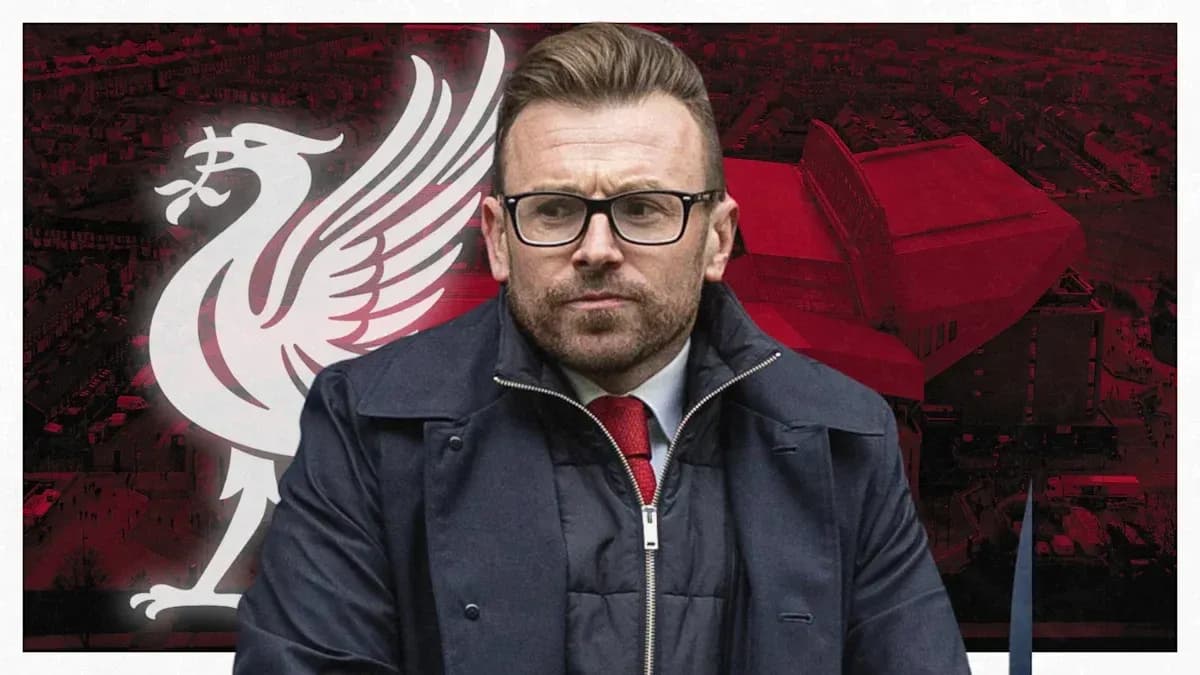 Man in glasses in front of Liverpool logo
