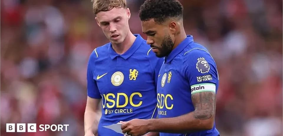 Two Chelsea players discussing during a match