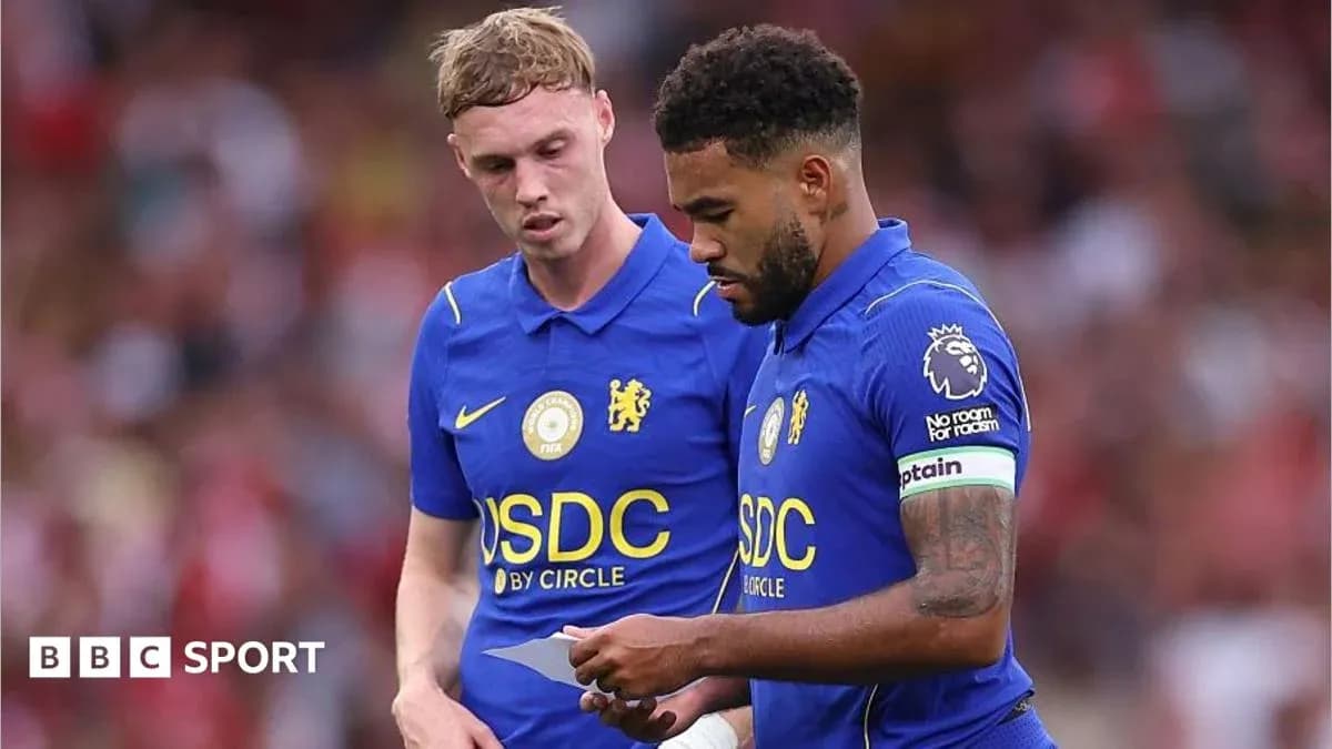Two Chelsea players discussing during a match