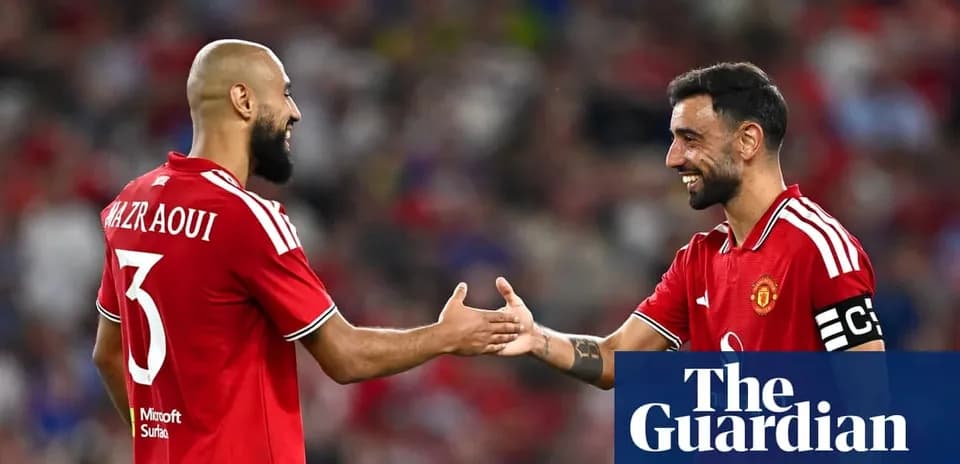 Two Manchester United players greeting each other