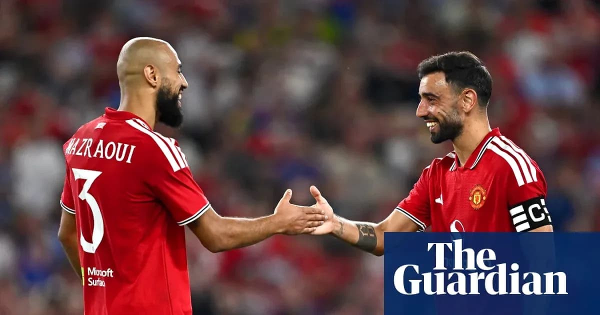 Two Manchester United players greeting each other