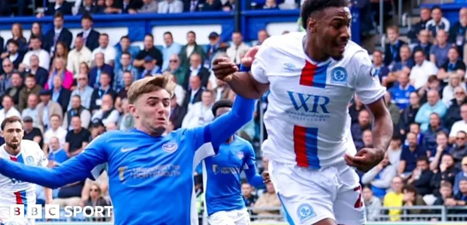 Two players battling for the ball during match