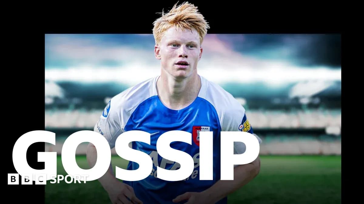 Player in blue and white kit on football field
