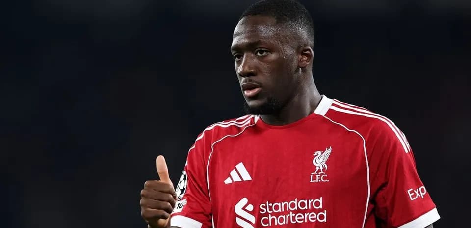 Player in Liverpool kit giving a thumbs up