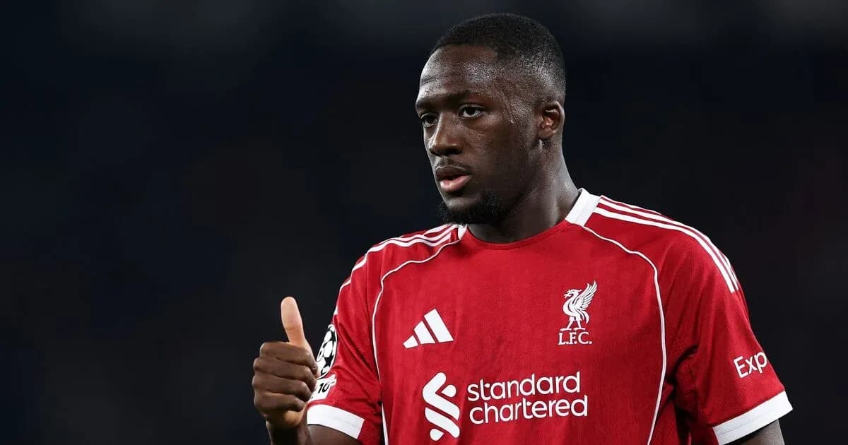 Player in Liverpool kit giving a thumbs up