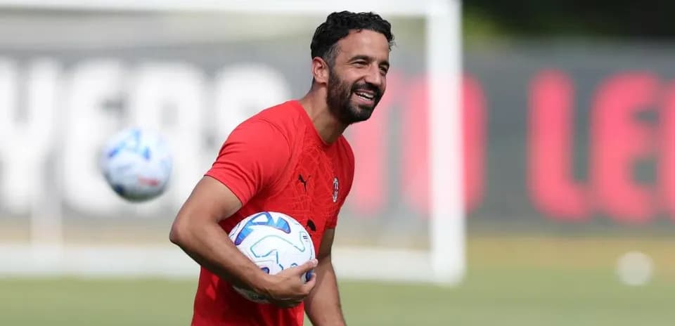 Player holding soccer balls during training session