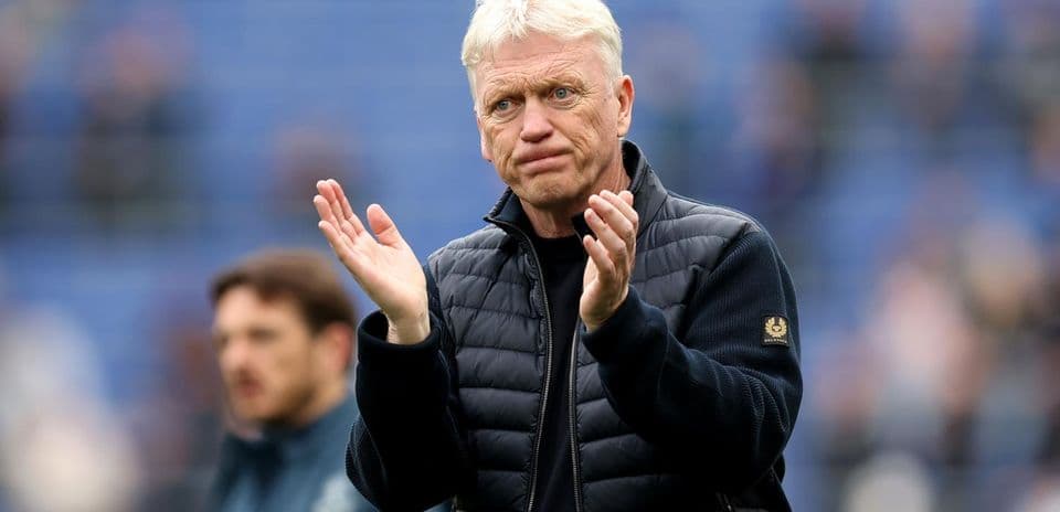 Manager applauding during a match on the sidelines