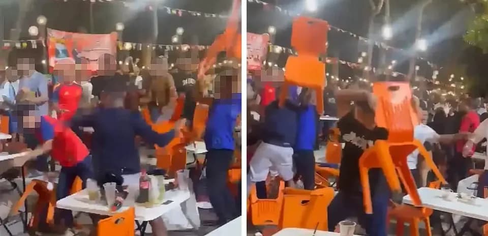 Crowd throwing chairs during a lively event