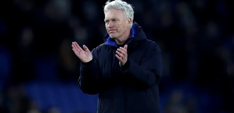 Manager applauding fans after the match