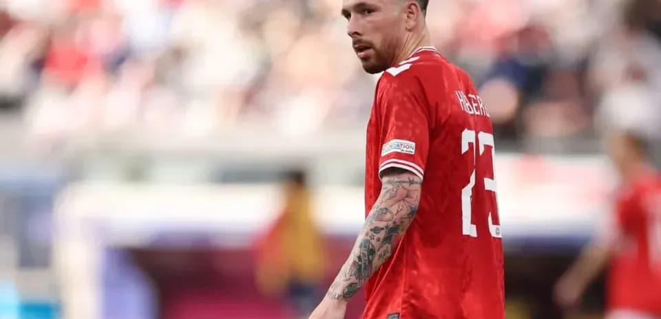 Player in red jersey during football match