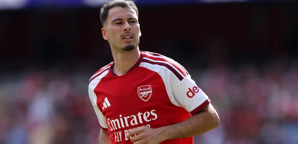Arsenal player in red kit during match