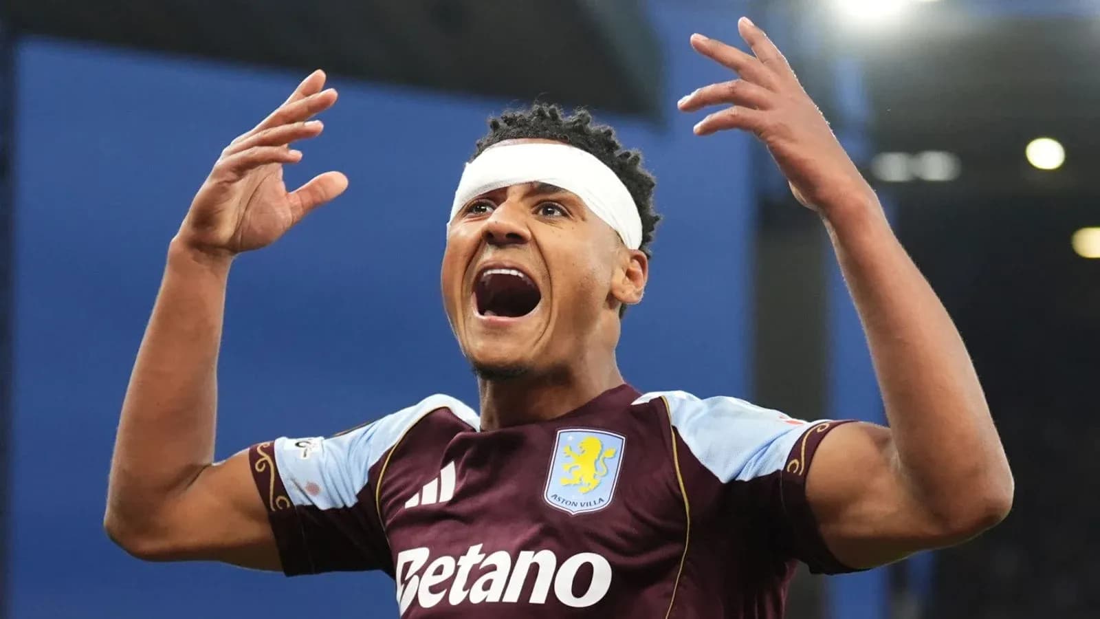 Player celebrating with bandage on head after goal