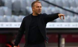 Coach directing players from the sidelines during match