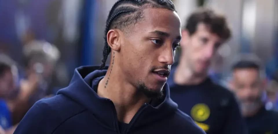 Player walking in team tracksuit before match