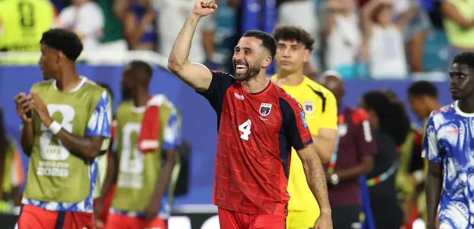 Player celebrating victory with raised fist after match