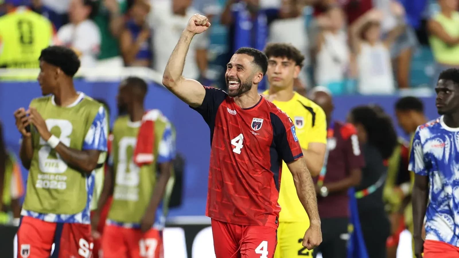 Player celebrating victory with raised fist after match
