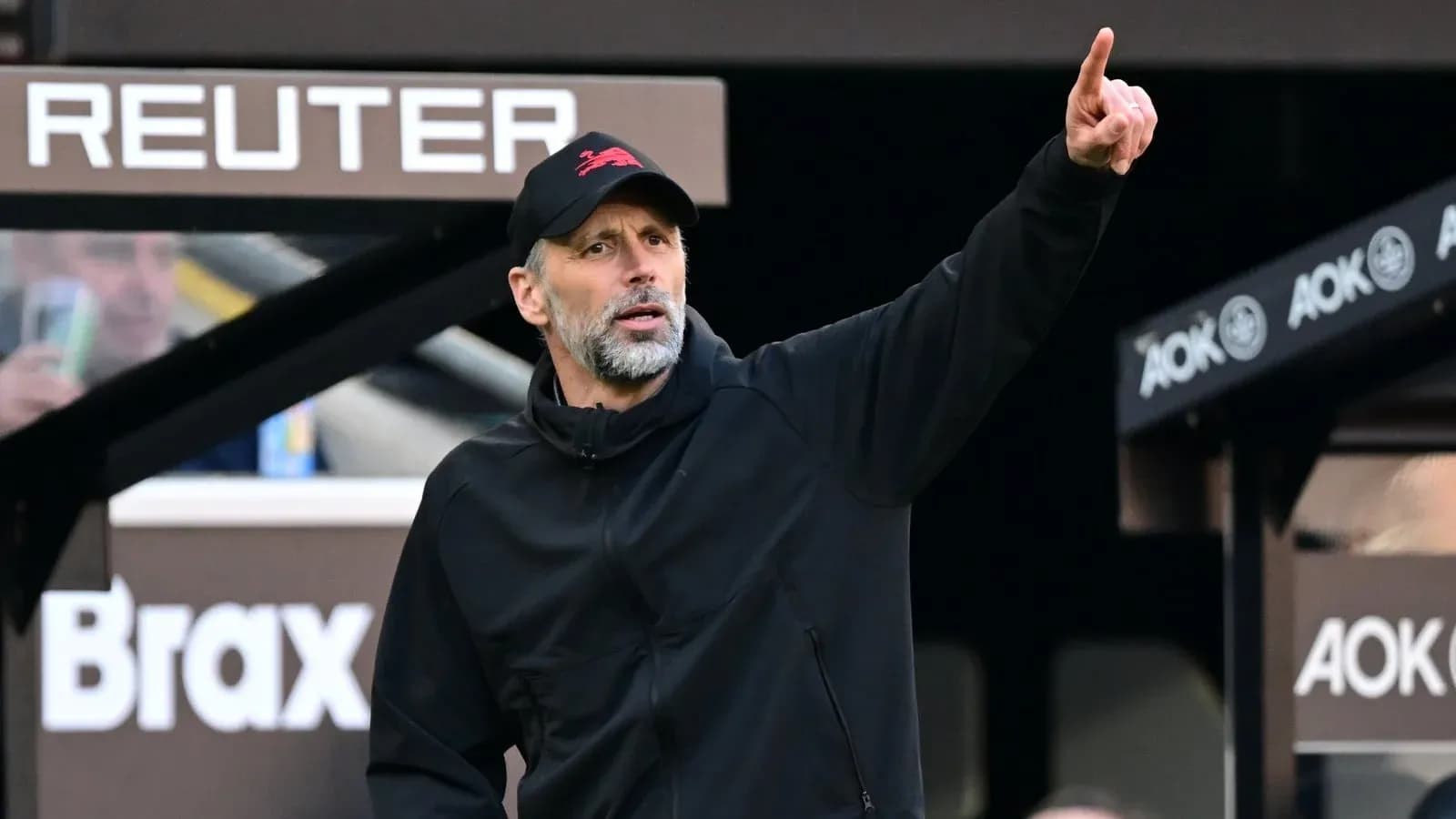 Coach giving instructions from the sidelines