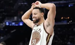 Player celebrating during basketball game with fans