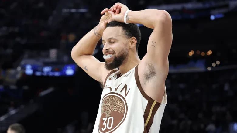 Player celebrating during basketball game with fans