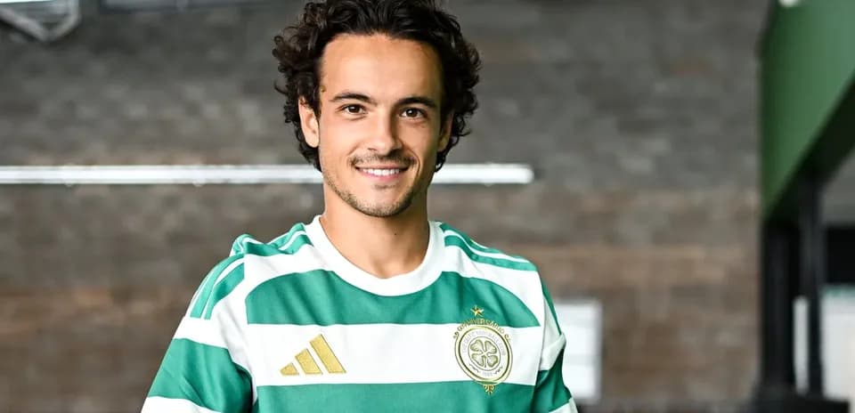 Player smiling in Celtic FC home kit