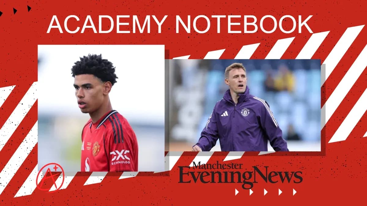 Young player in Manchester United kit and coach on pitch
