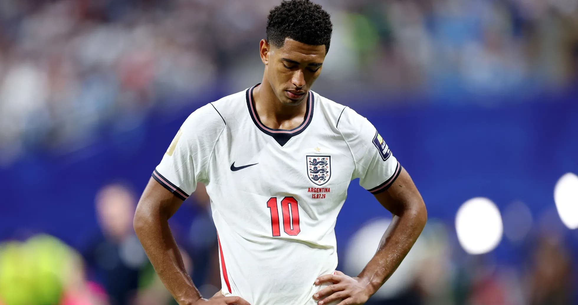 England player looking down during match