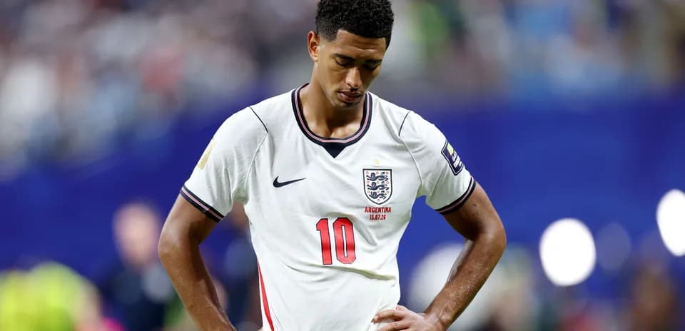England player looking down during match