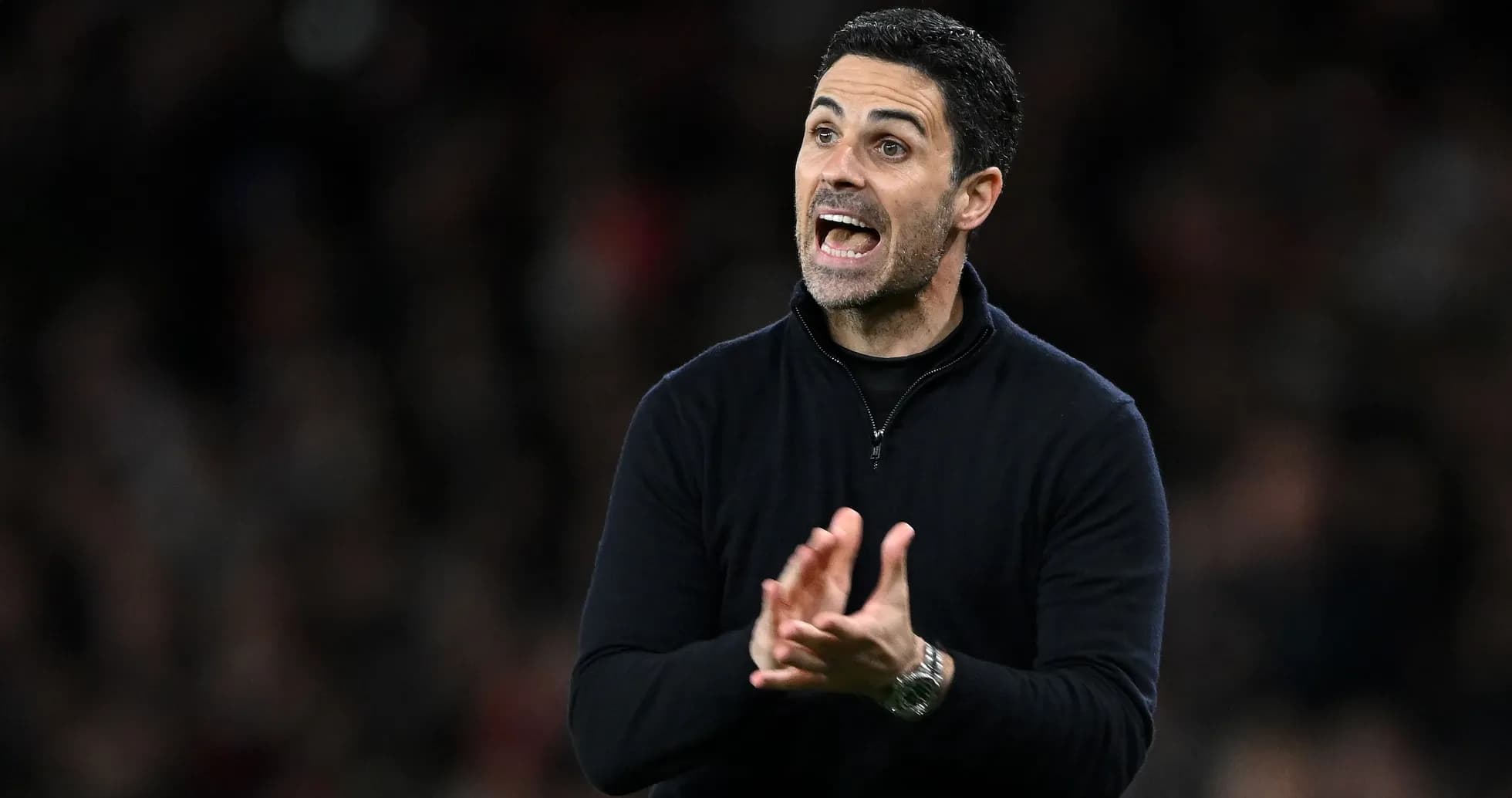 Manager gesturing during a football match on sideline