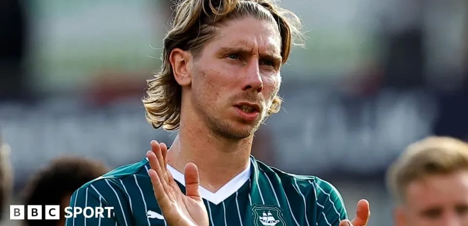 Player applauding fans after the match