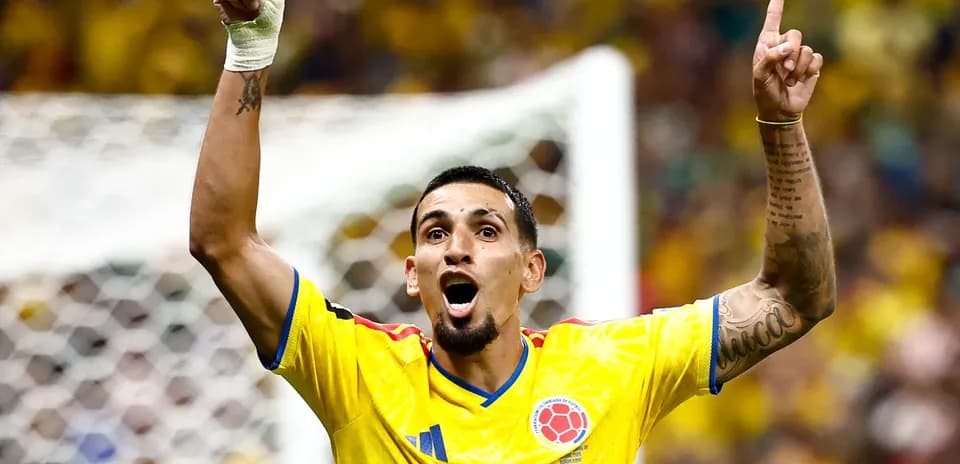 Player celebrating a goal in yellow jersey