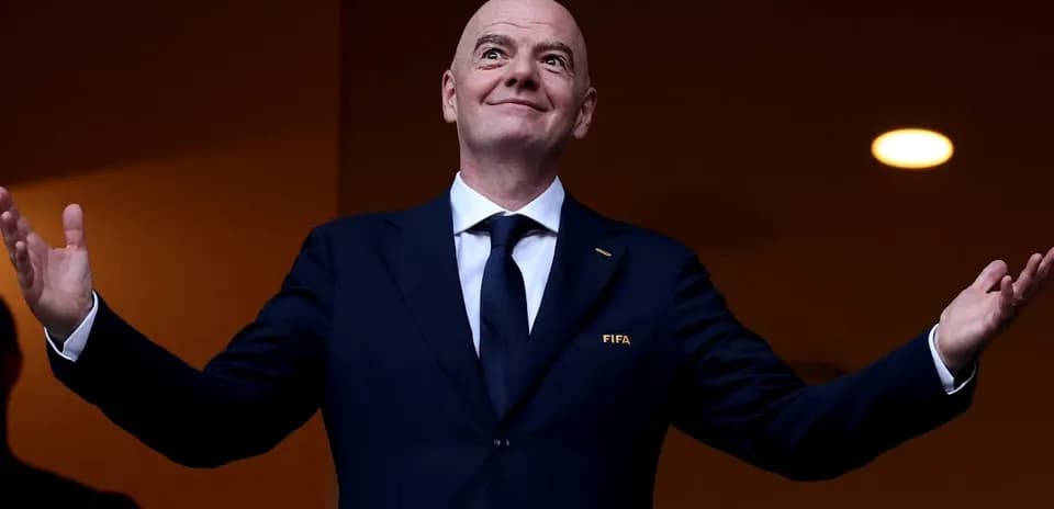 FIFA official gesturing from a balcony