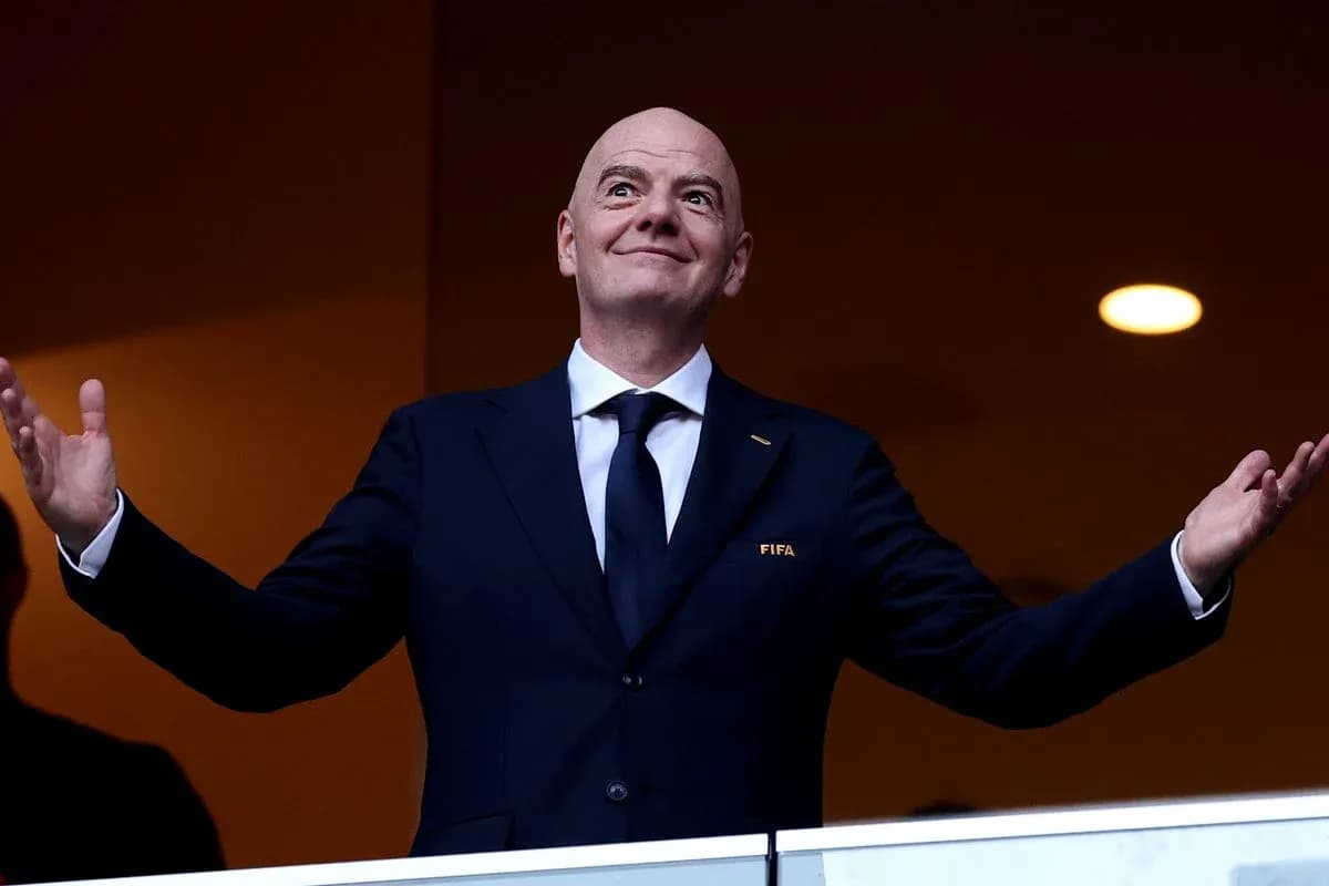 FIFA official gesturing from a balcony