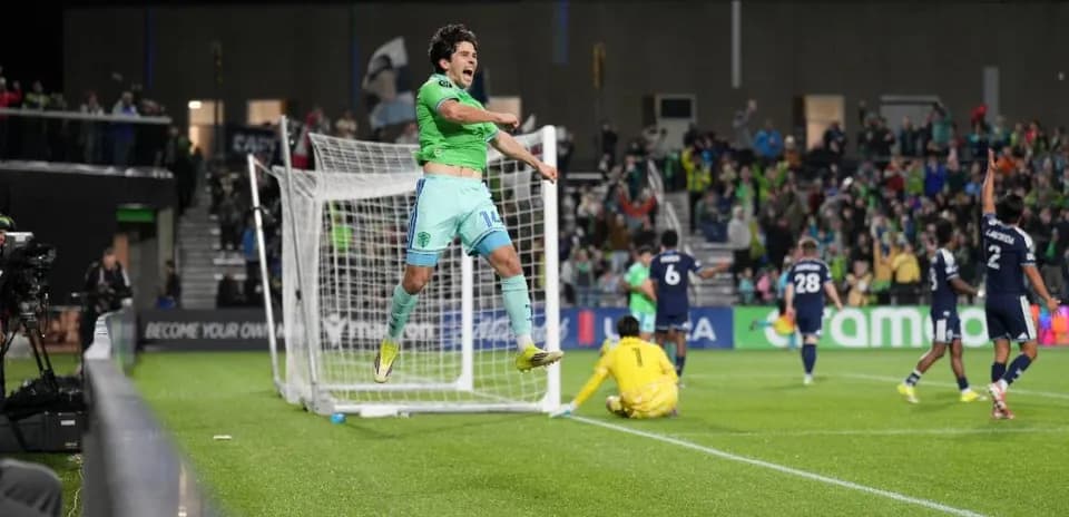 Player celebrating a goal during Seattle Sounders match