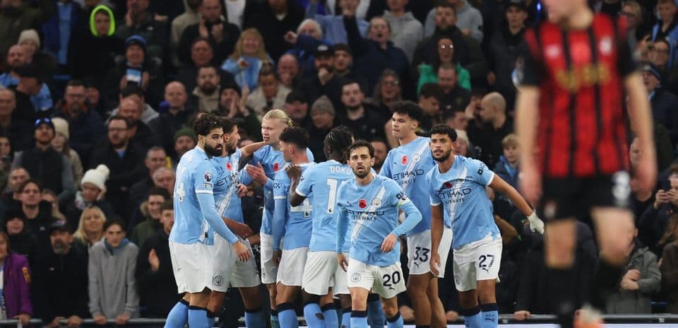 Manchester City players celebrate a goal