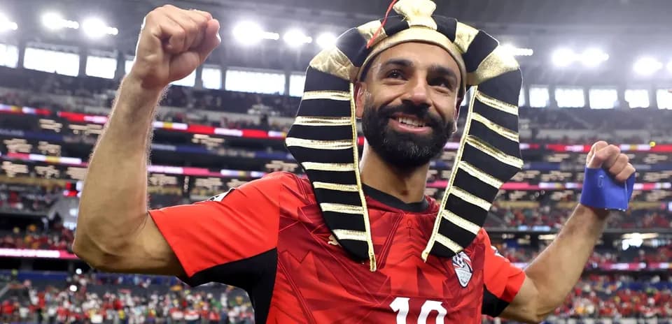 Player celebrating in Pharaoh headdress after match