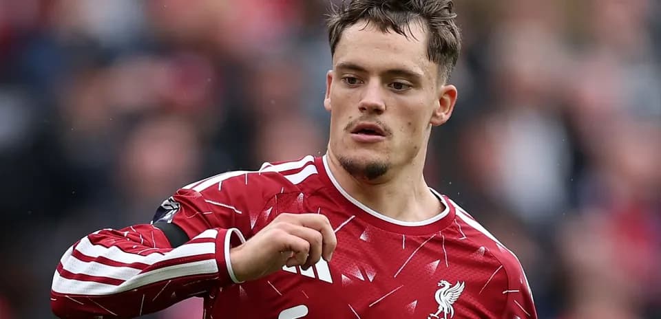 Player in Liverpool jersey gesturing during match