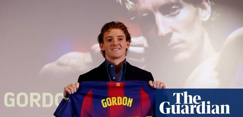 Player holding Barcelona jersey at presentation event