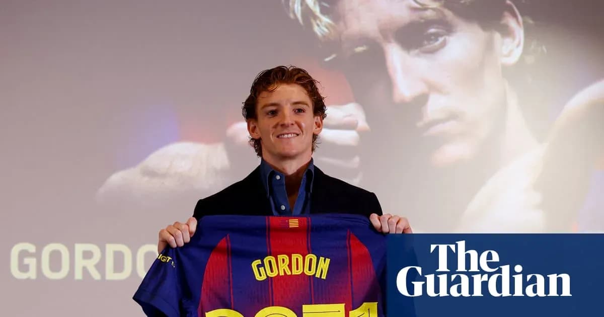 Player holding Barcelona jersey at presentation event