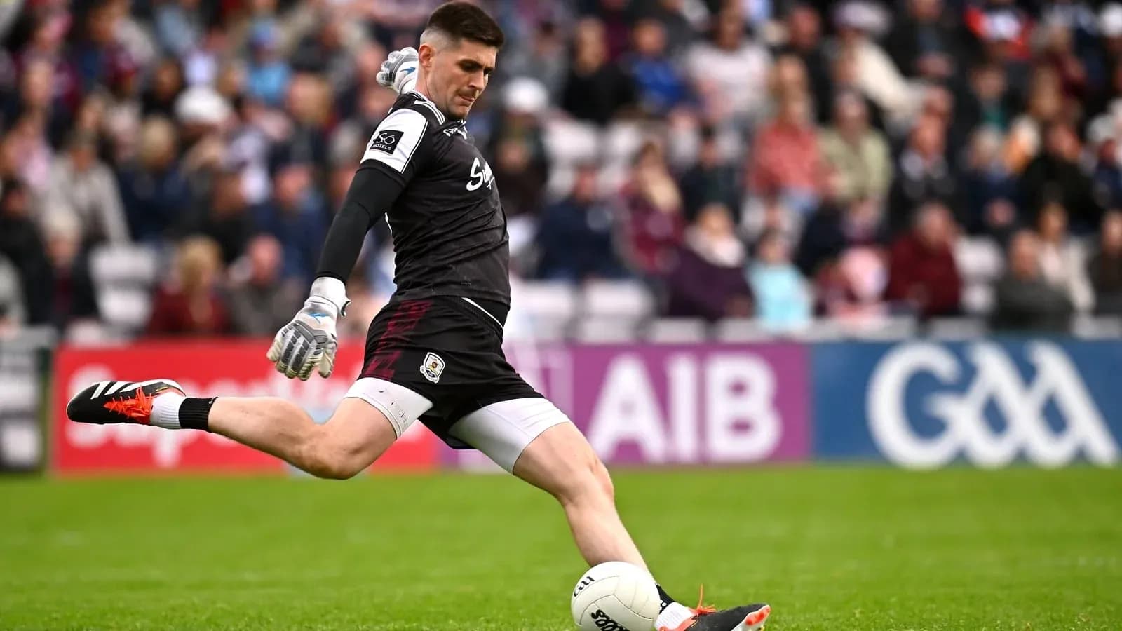 Goalkeeper kicking a ball during a match