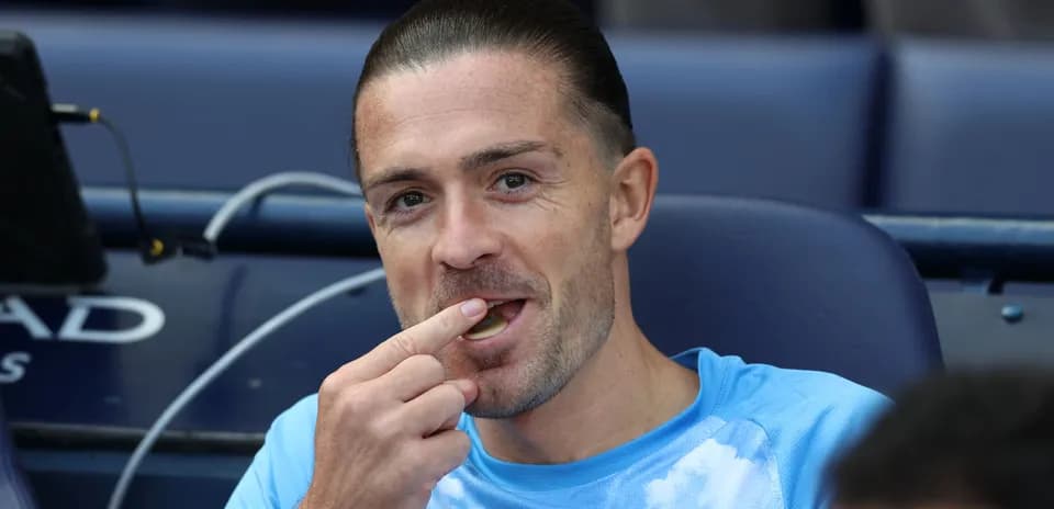 Player seated on bench, eating during match
