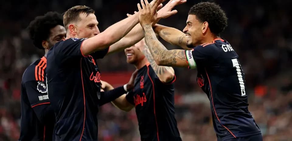 Players celebrating a goal during match