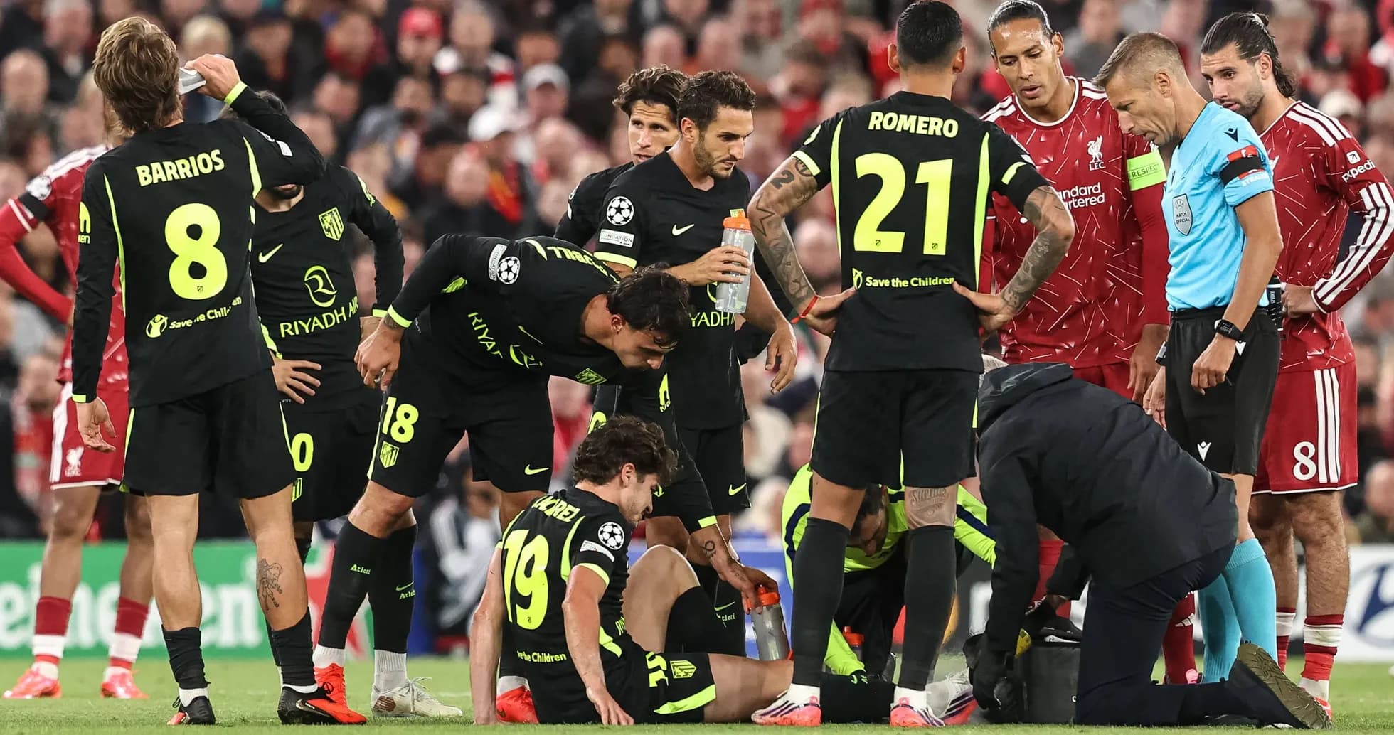 Atletico Madrid players attending to injured teammate