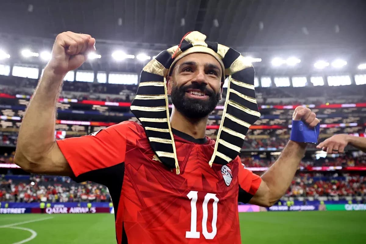Player celebrating in Egyptian jersey and pharaoh headdress