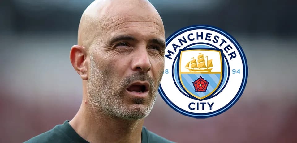 Manager with Manchester City logo in background