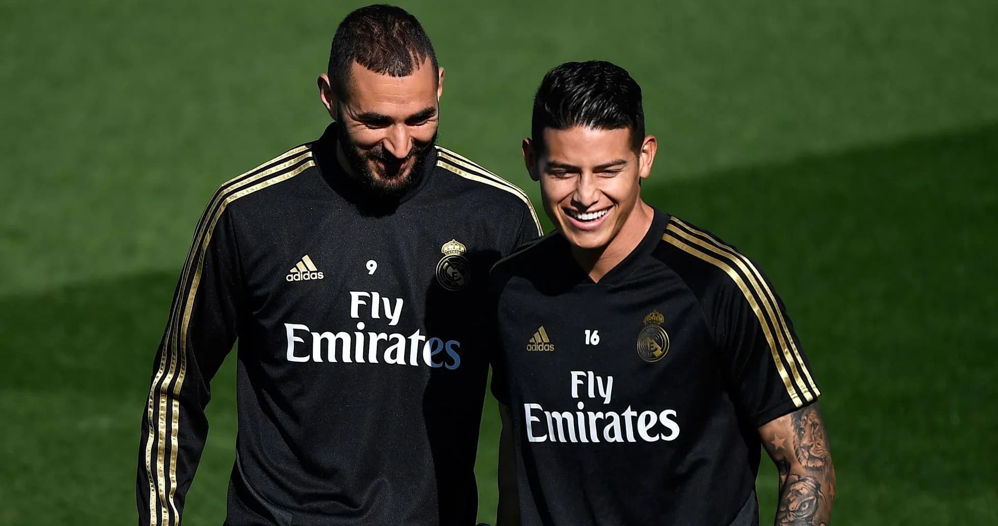 Benzema and James smiling during training session