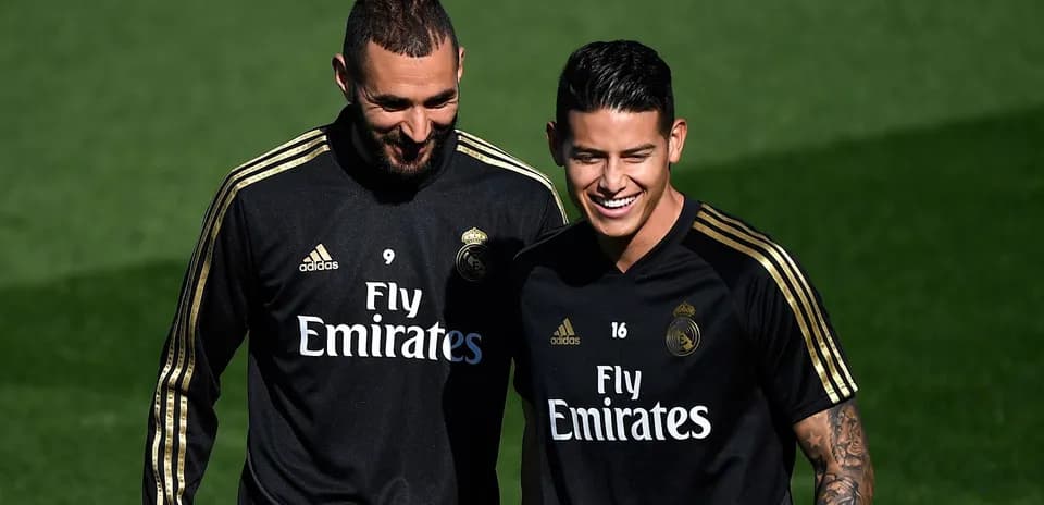 Benzema and James smiling during training session
